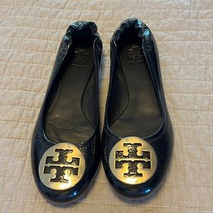 Tory Burch patent leather flats with gold emblem